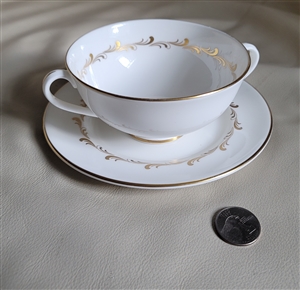 Royal Doulton Rondo pattern fine bone porcelain cream soup bowl and saucer set featuring two handles and gold swirl border