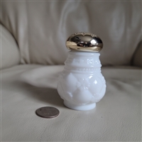 Preowned vintage Avon Moonwind milk glass powder sachet bottle with gold-tone cap