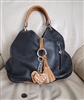 2010 Borse In Pelle womens avant garde black leather handbag signature tassel charms preowned sells as is