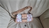 Pre-owned vintage Guess multicolor signature logo baguette bag measuring 10 by 5 inches with a thick tan shoulder strap