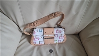 Pre-owned vintage Guess multicolor signature logo baguette bag measuring 10 by 5 inches with a thick tan shoulder strap