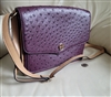 Giani Bernini medium shoulder purse in eggplant purple embossed ostrich faux leather with an adjustable strap and silver logo charm