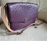 Giani Bernini medium shoulder purse in eggplant purple embossed ostrich faux leather with an adjustable strap and silver logo charm