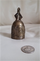 Vintage cast brass bronze temple meditation bell with raised relief details and figural handle