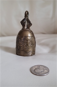 Vintage cast brass bronze temple meditation bell with raised relief details and figural handle