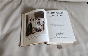 Vintage 1946 Robinson Crusoe hardcover book by Daniel Defoe with 425 plus pages library book wear
