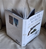 Front cover of a history of the world in one hundred weapons two thousand eleven hardcover book