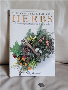 Front cover of the complete book of herbs nineteen eighty eight by Lesley Bremness with a dust jacket