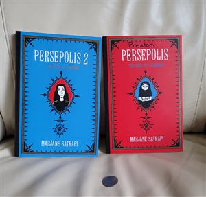 Persepolis memoir in comic 2 books by Marjane Satrapi blue and red hardcovers