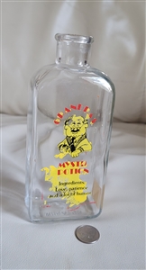 Vintage 1970s Wheaton USA Grandpas Mystic Potion glass bottle showing novelty label and embossed base hallmark