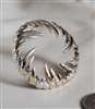 Vintage Sarah Coventry two tone gold and silver swirl brooch front view