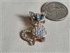 Vintage beaded cat brooch featuring blue cat-eye cabochon eyes and clear beads body