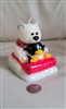 Bear and penguin riding on a sled decorative wax candle 1990s