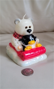 Bear and penguin riding on a sled decorative wax candle 1990s