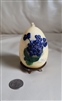 Egg candle with metal base blue flowers accents