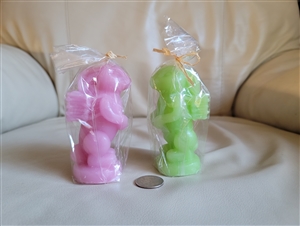 Set of 2 vintage Luminescence bunny rabbit wax candles pink and green with baskets on back