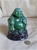 Vintage Buddha wax candle in jade green color on black base