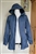 Front view of mountain hardwear womens size xs blue waterproof rain parka with mesh lining