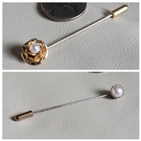 Set of two vintage faux pearl hat pins in gold and silver tone metal shown with coin for scale