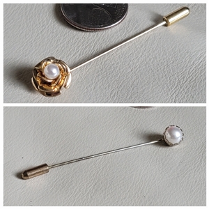 Set of two vintage faux pearl hat pins in gold and silver tone metal shown with coin for scale