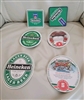 A set of six reversible Heineken beer mats showing both the logo side and the hockey trivia reverse side