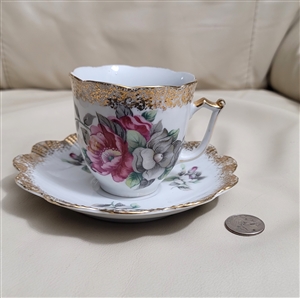 Large porcelain mustache cup and saucer floral
