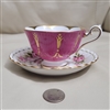Vintage mismatched European porcelain teacup and saucer set with floral pattern
