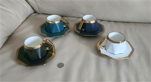 Set of six vintage porcelain multicolor teacups and saucers in black white navy blue and emerald green with gold geometrical pattern