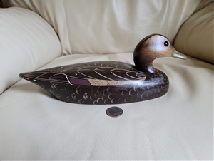 Vintage hand carved and painted wooden duck decoy home decor display piece showing dark brown body, tan neck, and detailed scalloped wings