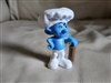 Front view of Blue Smurf Baker 2011 McDonalds Happy Meal toy wearing chef hat and holding rolling pin