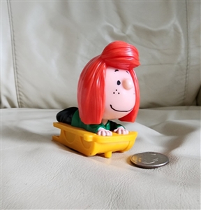 McDonalds happy meal peanuts peppermint patty on a sled moveable toy three by three inches