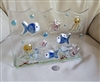 1990s Italian rectangular nautical art glass tealight candle holder with wavy top featuring applied blue fish yellow octopuses pink starfish and red coral