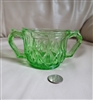 Vintage green depression glass sugar bowl with two handles and star pattern base