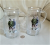 vintage set of two 1980 glass beer steins shaped like golf bags with gold rim and golfer decoupage in preowned condition
