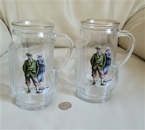 vintage set of two 1980 glass beer steins shaped like golf bags with gold rim and golfer decoupage in preowned condition
