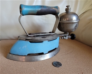 Vintage blue Coleman Instant-Lite gas iron with wood handle