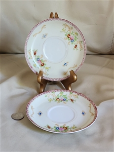 Set of two vintage Japanese porcelain saucers with floral design