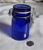 Vintage cobalt blue glass storage jar with wire bail closure and glass lid