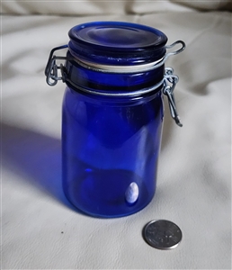 Vintage cobalt blue glass storage jar with wire bail closure and glass lid