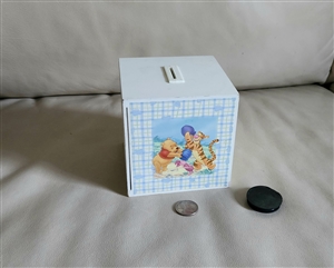 Vintage white Disney money bank with Winnie the Pooh picture frame side and coin slot