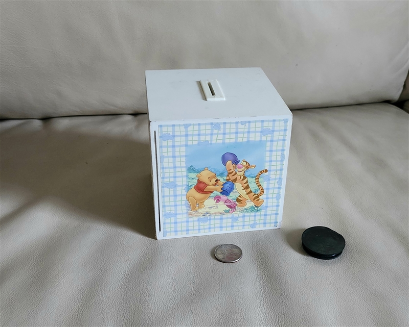 Vintage white Disney money bank with Winnie the Pooh picture frame side and coin slot