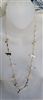 Gold tone station chain women necklace showing cast animal charms including birds, frogs, turtles, and bears
