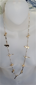Gold tone station chain women necklace showing cast animal charms including birds, frogs, turtles, and bears