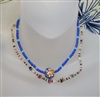 Vintage 2000s handmade choker set showing shell fragment strand on nylon line and blue beaded strand with floral painted wooden bead