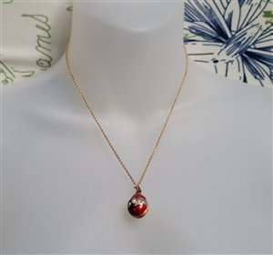 Guilloche style vintage red enamel egg pendant with faux pearls on gold tone chain