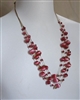preowned vintage pink cat eye multi strand waterfall necklace with gold tone charms