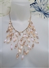Vintage women's necklace in gold tone metal with lace cascading glass beads in metallic colors.