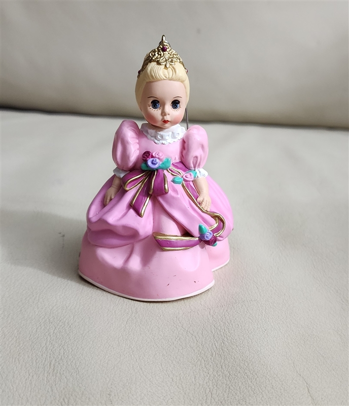 1995 Madame Alexander Cinderella Hallmark Keepsake ornament with spots on the dress and a folded box