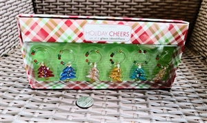 Preowned vintage set of four textured art glass Christmas tree wine glass charms in box