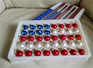 Glass ornaments display an American Flag design